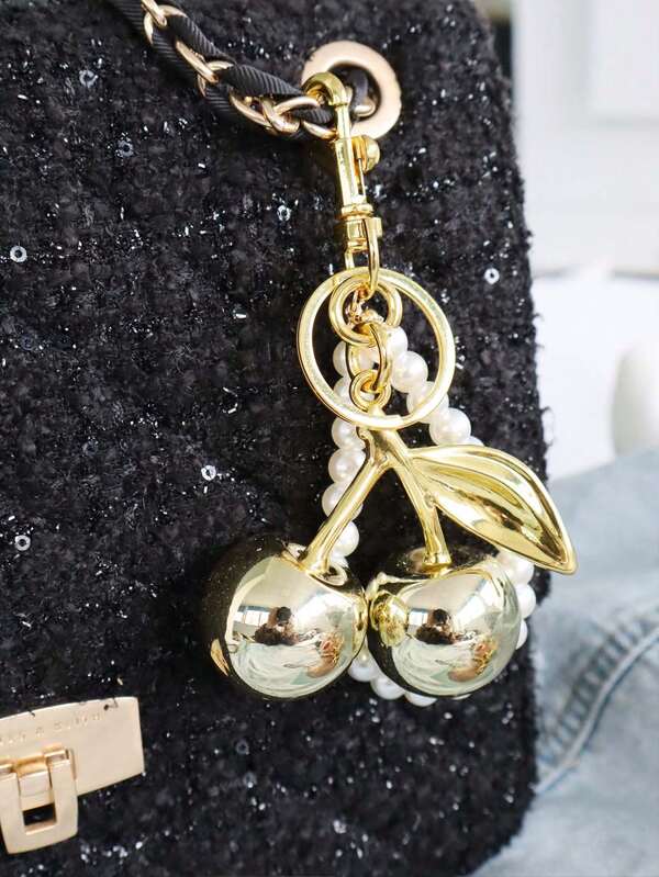 Charm llavero cerezas doradas