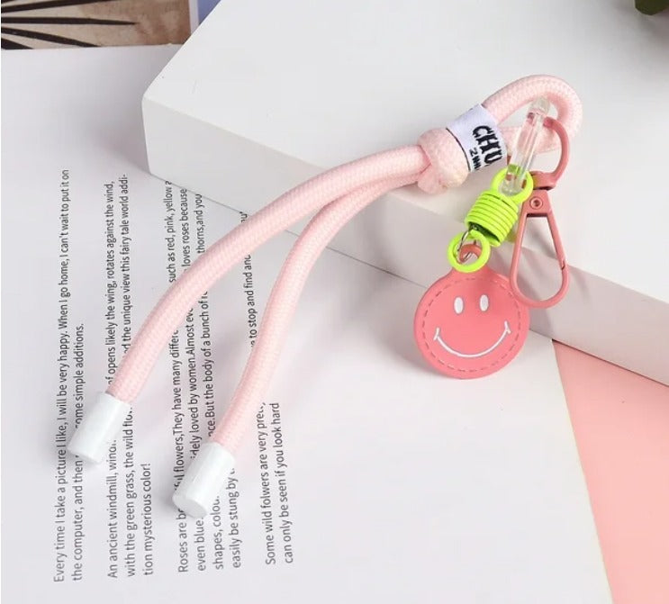 Charm carita feliz rosa